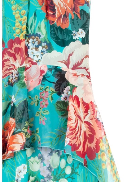 Lange georgettejurk met bloemen en ruches op de heupen