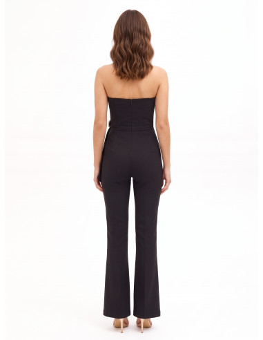 Uitlopende jumpsuit van technische stof met siergesp en drapering Rinascimento
